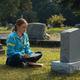 Max sits at Billy's grave.